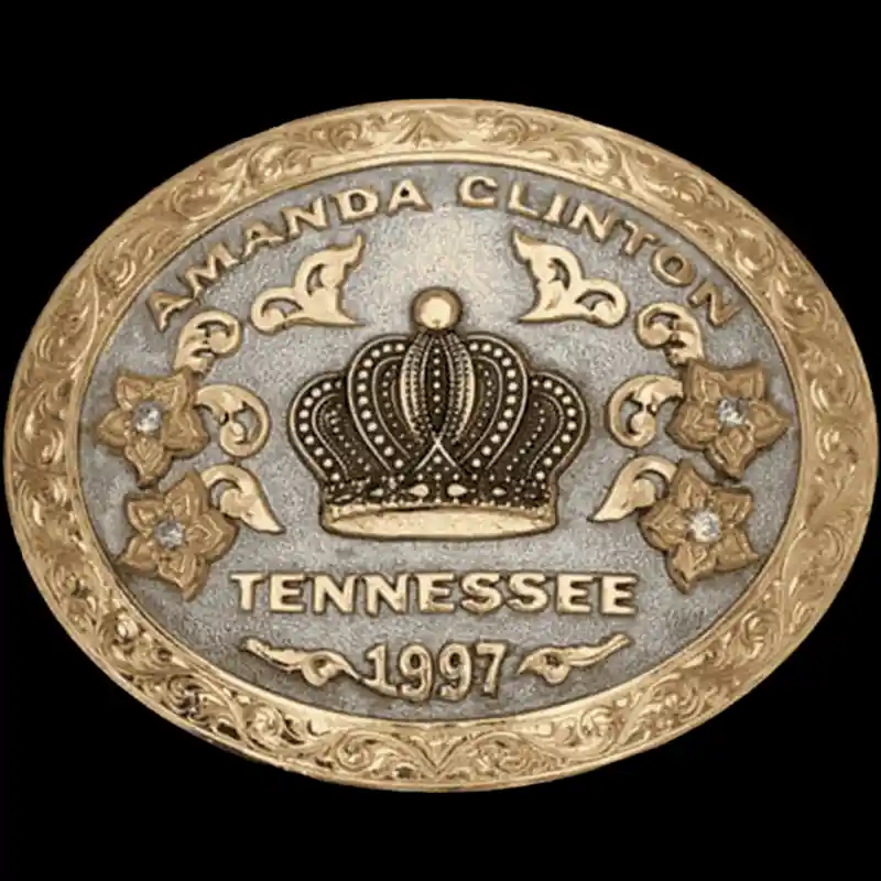 A custom oval rodeo queen belt buckle featuring a crown figure 