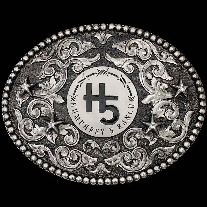 A custom oval antiqued ranch brand belt buckle for Humphrey 5 Ranch featuring its custom logo 