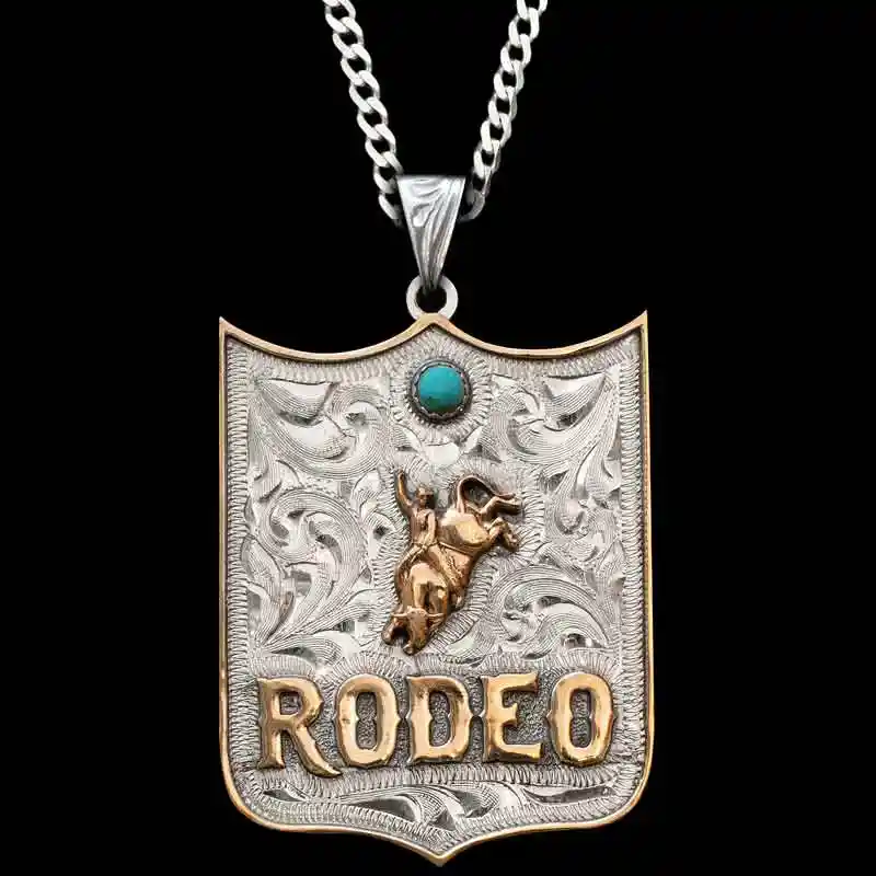A custom pendant necklace featuring personalized bronze lettering and a bull rider figure, with a sterling silver chain 