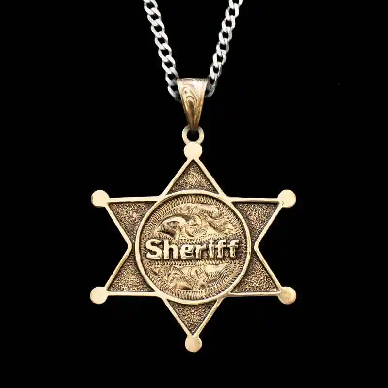 A custom pendant necklace featuring the shape of a sheriff's badge, with a sterling silver chain