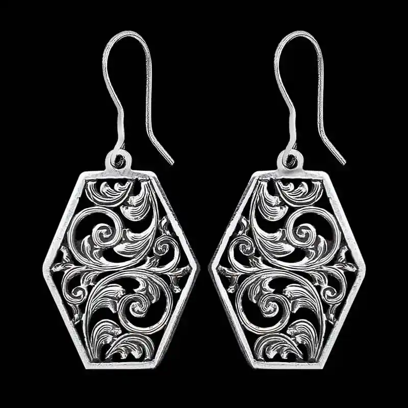 A pair of silver western earrings for women, hexagonal shaped, with filigrane details