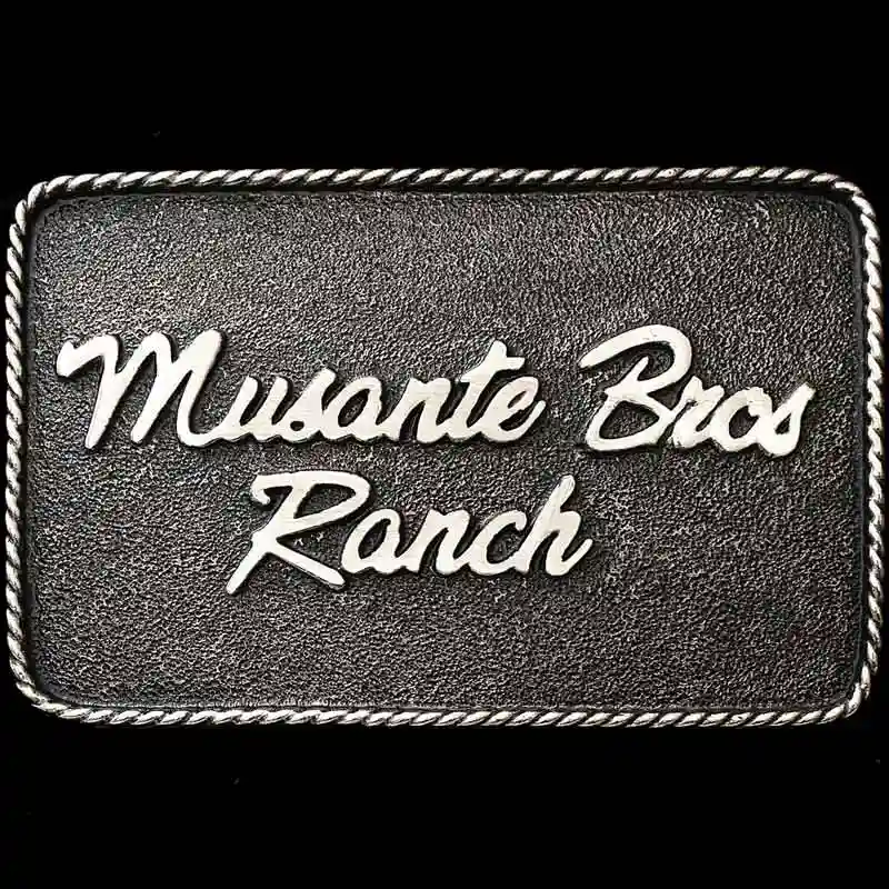 A custom antiqued silver ranch belt buckle for Musante Bros Ranch 