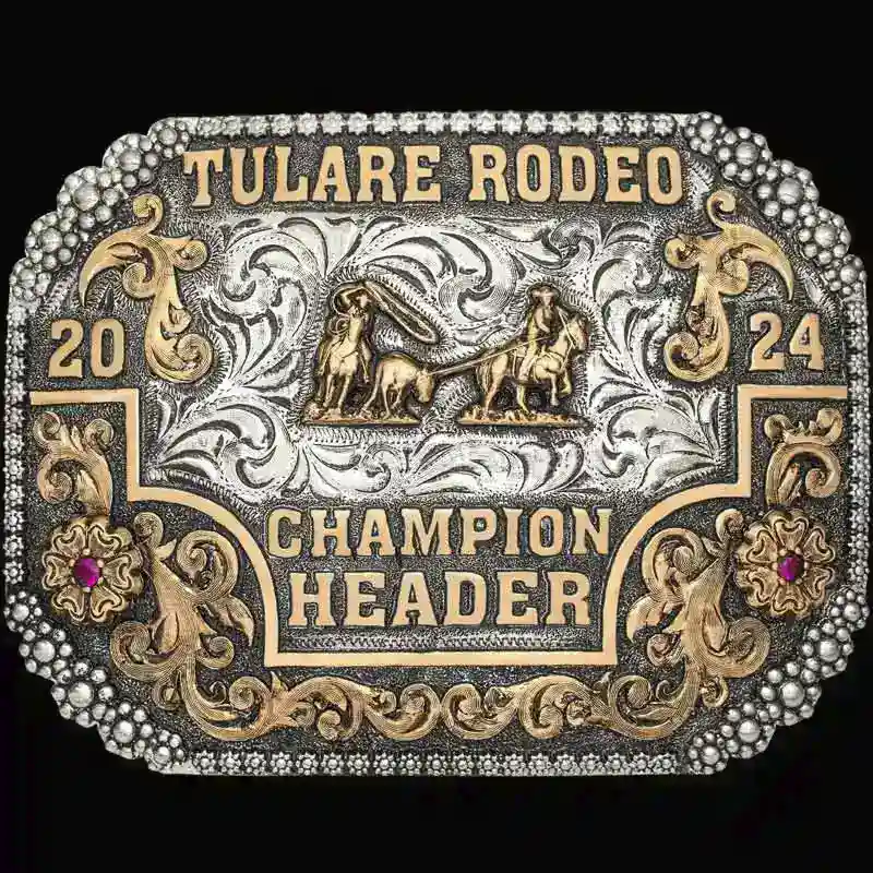 A custom rodeo belt buckle trophy for Tulare Rodeo Champion header featuring a team roping figure 