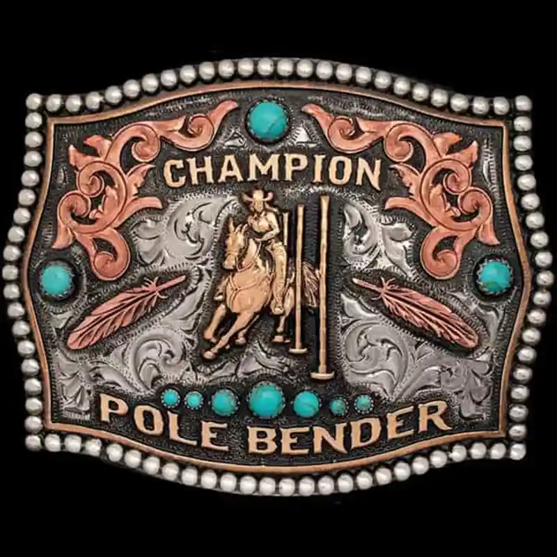 A custom women's rodeo belt buckle trophy featuring a pole bender cowgirl figure, feathers and turquoise stones