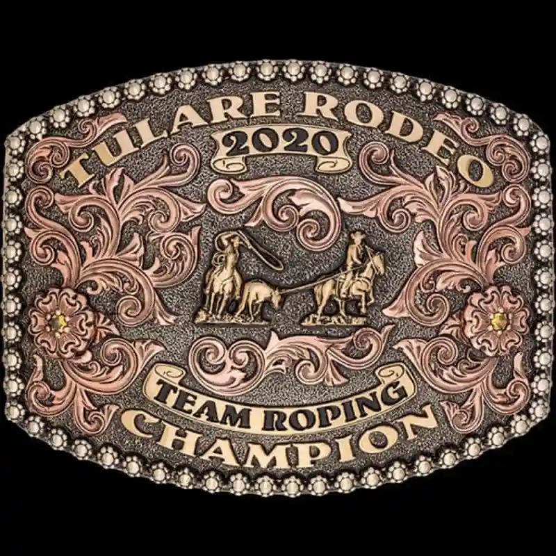 A custom award rodeo belt buckle for Tulare Rodeo Team Roping Champion featuring a team roper figure 