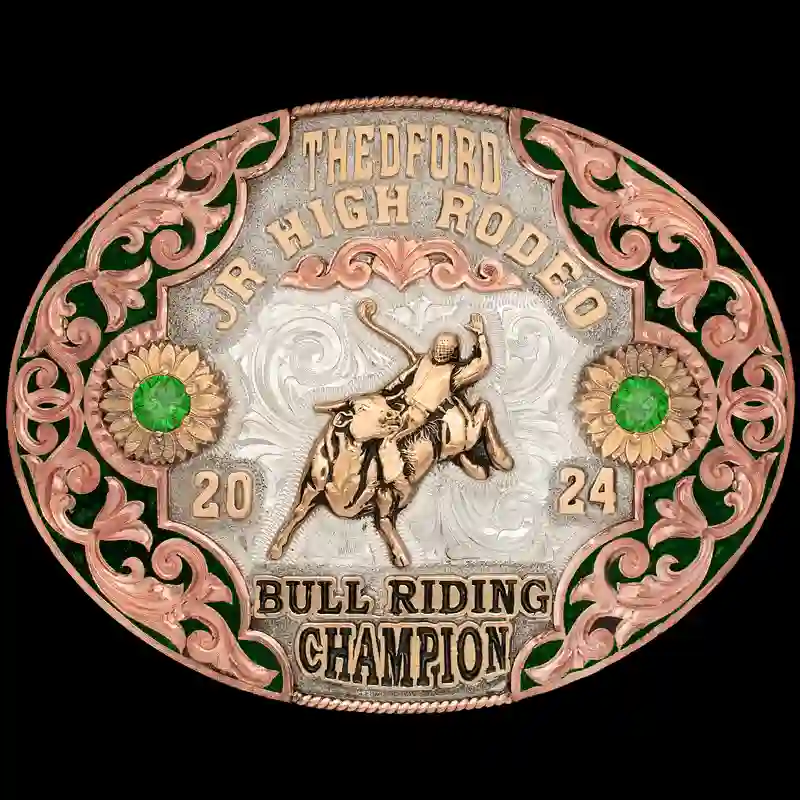 A custom oval turquoise belt buckle trophy for Thedford Junior High Rodeo Bull Riding Champion featuring a bull rider figure 