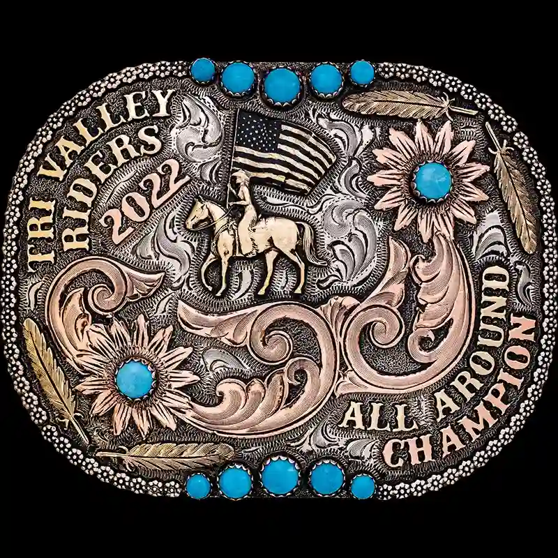 A custom women belt buckle trophy for Tri Valley Riders All Around Champion featuring a cowgirl with the american flag figure 